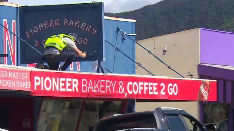 Police investigating what appear to be bullet holes in a bakery's sign in Featherston.