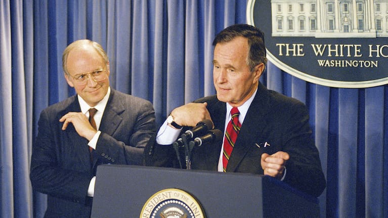 President George HW Bush gestures during a news conference at the White House on Friday, March 10, 1989, where he announced his selection of Dick Cheney to become Defense Secretary.