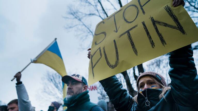 Demonstrators gather at the White House calling for President Joe Biden to take a more aggressive response to Russia's actions in regards to the invasion of Ukraine.