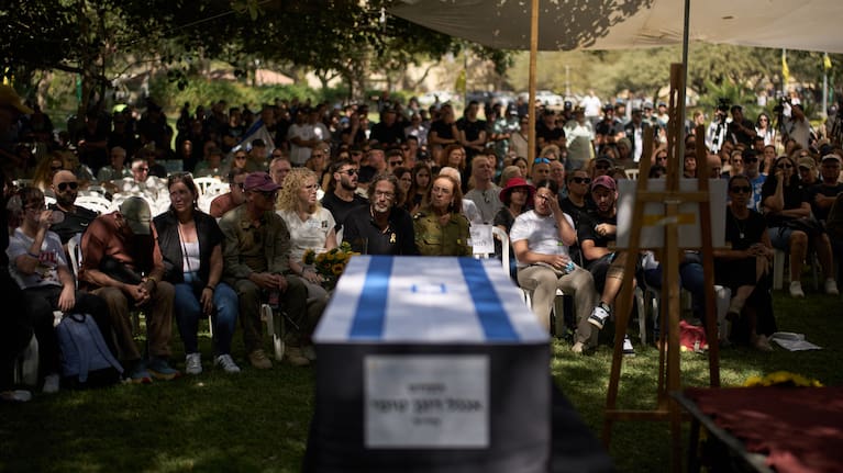 Relatives and friends attend the funeral of slain hostage Ronen Engel after his body was returned from Gaza as part of a ceasefire agreement between Israel and Hamas at Kibbutz Nir Oz, southern Israel.