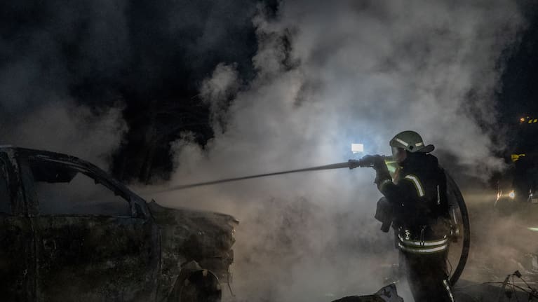 Rescue workers put out a fire of a residential building damaged by a Russian strike in Kharkiv, Ukraine.