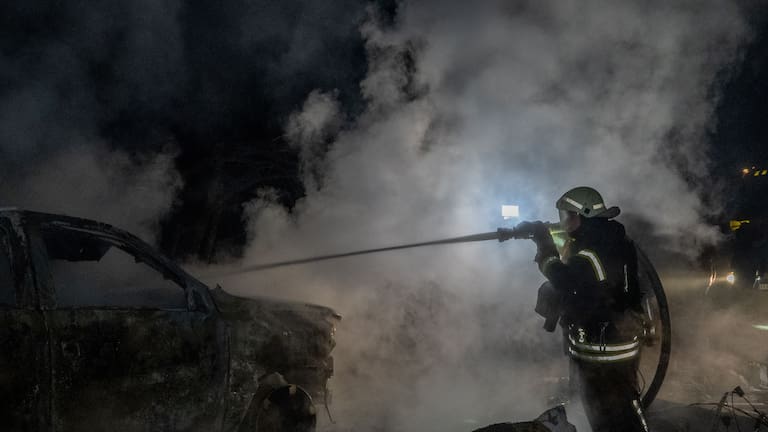 Rescue workers put out a fire of a residential building damaged by a Russian strike in Kharkiv, Ukraine.