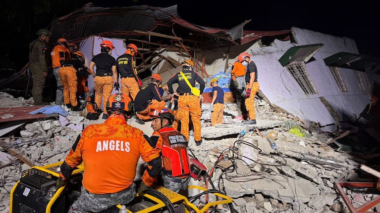 Rescuers search for survivors underneath rubble in Bogo, Philippines