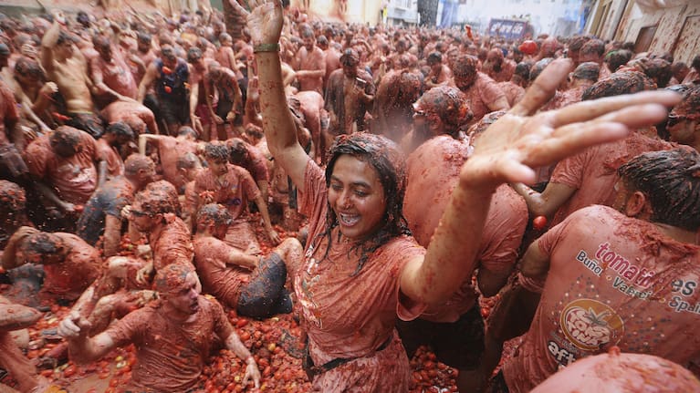 Revelers throw tomatoes at each other during the annual "Tomatina" tomato fight fiesta, in the village of Bunol near Valencia, Spain.
