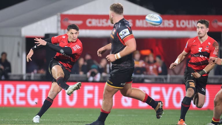 Rivez Reihana kicks for the Crusaders against the Chiefs.