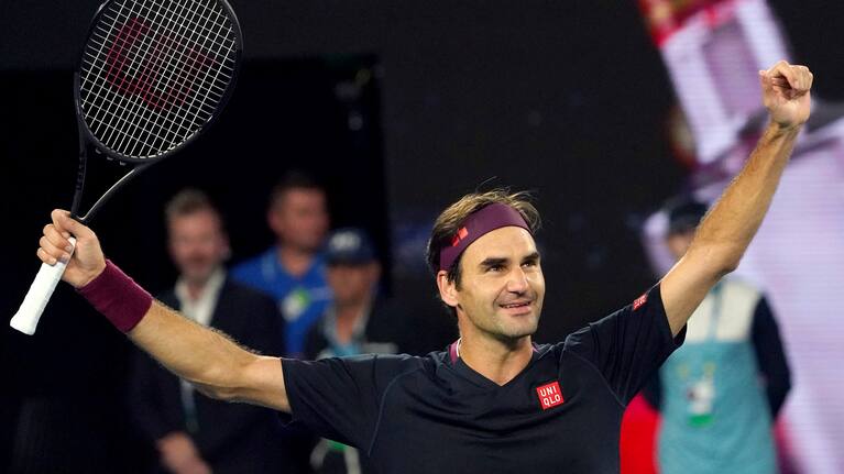 Roger Federer celebrates eating John Millman