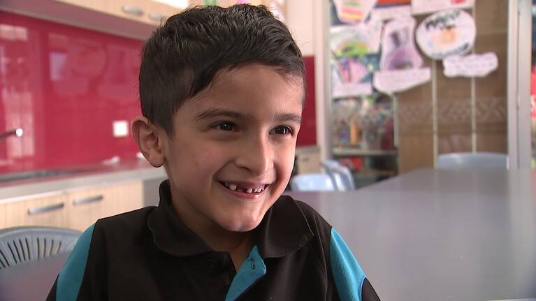 Rowley School student Roman Saptoka shows off his smile.