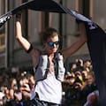 Ruth Croft crosses the finish line at the Ultra-Trail du Mont-Blanc course.
