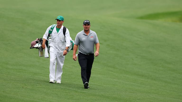 Ryan Fox walks up the 13th fairway with his caddie, Dean Smith, during a practice round at Augusta National.