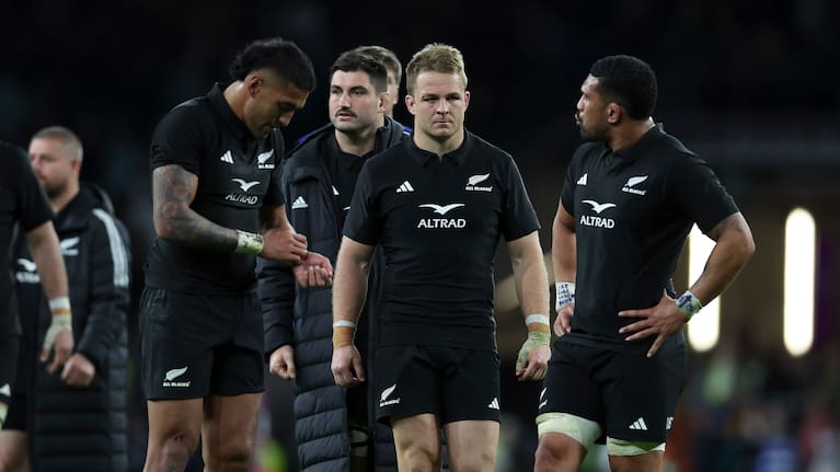 Sam Cane looks on with teammates after the All Blacks' loss to the Springboks.