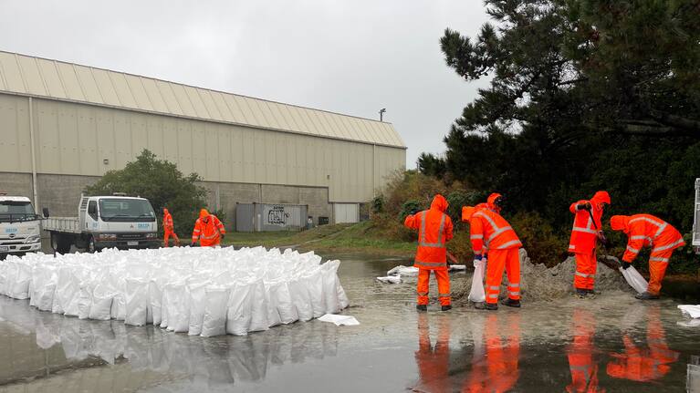 Sandbags being filled in South Dunedin.