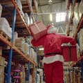 Santa in the warehouse picking up gifts (file image)
