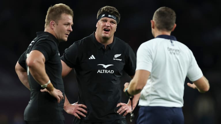 Scott Barrett gets his second lot of bad news from ref Matt Carley at Twickenham with Sam Cane looking on.