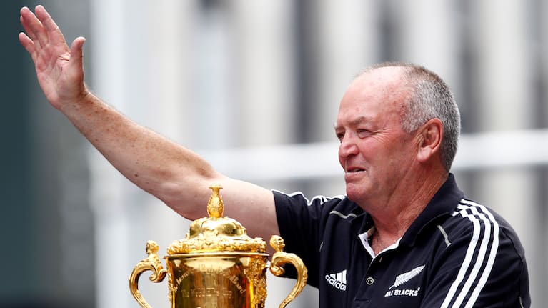 Sir Graham Henry waves at fans during the All Blacks 2011 RWC celebration parade in Auckland.