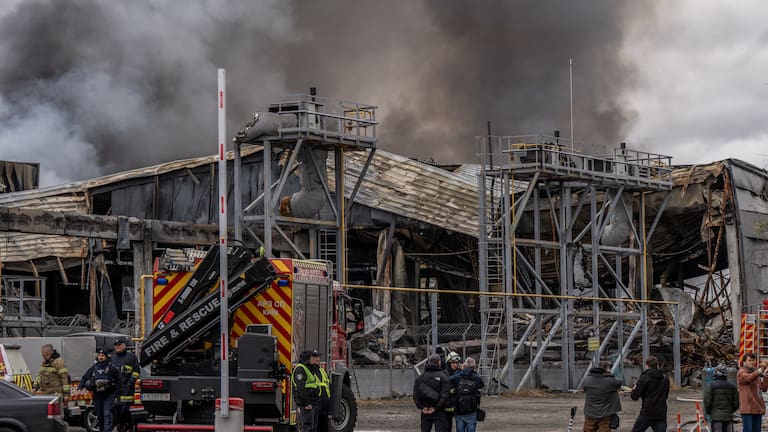Smoke bellows from a warehouse that caught fire following a Russian attack, Saturday, Oct. 25, 2025, in Kyiv, Ukraine