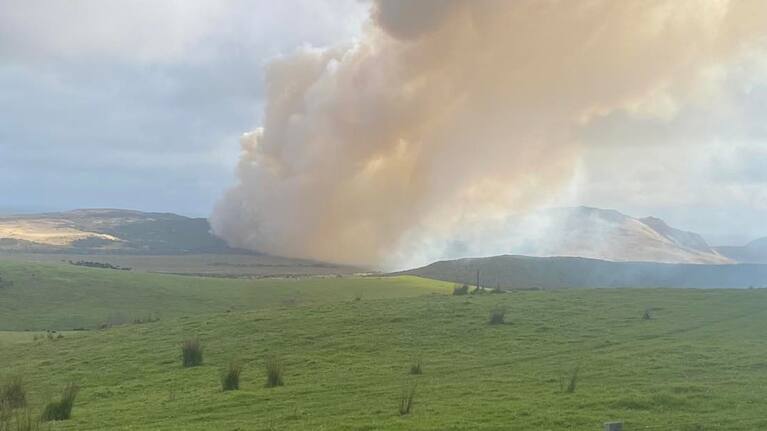 Smoke rises from a fire at Cape Maria van Diemen, near Cape Reinga.