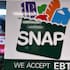 SNAP EBT information sign displayed at a gas station in Riverwoods, Illinois.