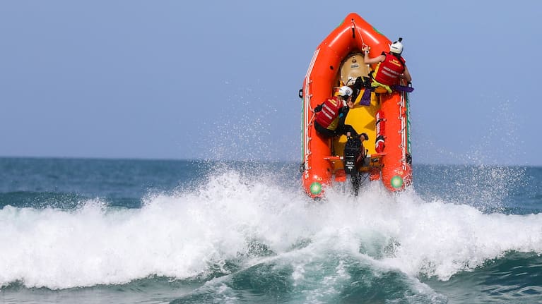 An IRB goes airborne at Piha beach. Photo: Rob Ferguson