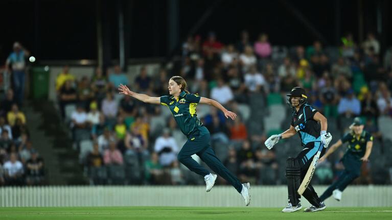 Tayla Vlaeminck of Australia fields off her own bowling against New Zealand