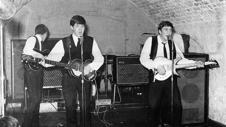 The Beatles playing at the Cavern Club in Liverpool, 1962, with McCartney playing his Höfner bass.
