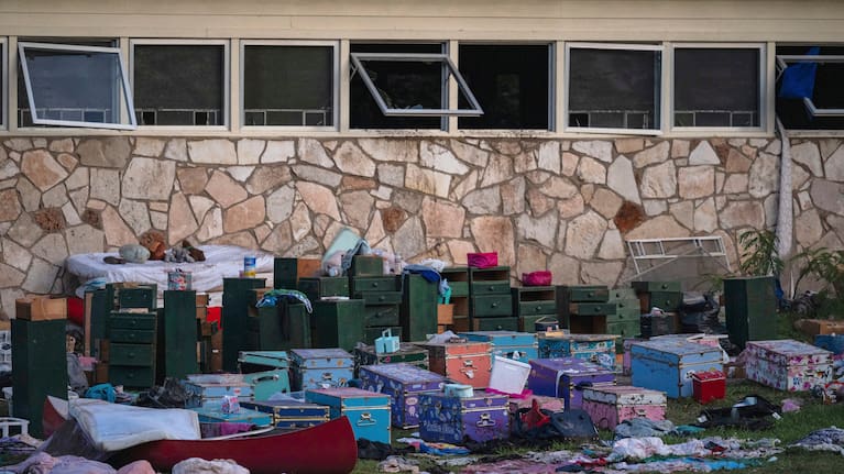 The belongings of campers sit outside one of Camp Mystic's cabins near the Guadalupe River in Hunt, Texas, July 7, 2025, after a deadly flash flood swept through the area.