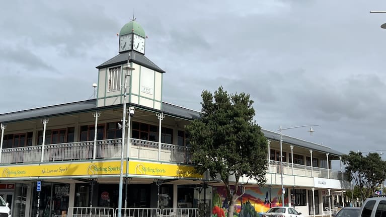 The clock tower sits on the corner of Pollen Street and Main Street