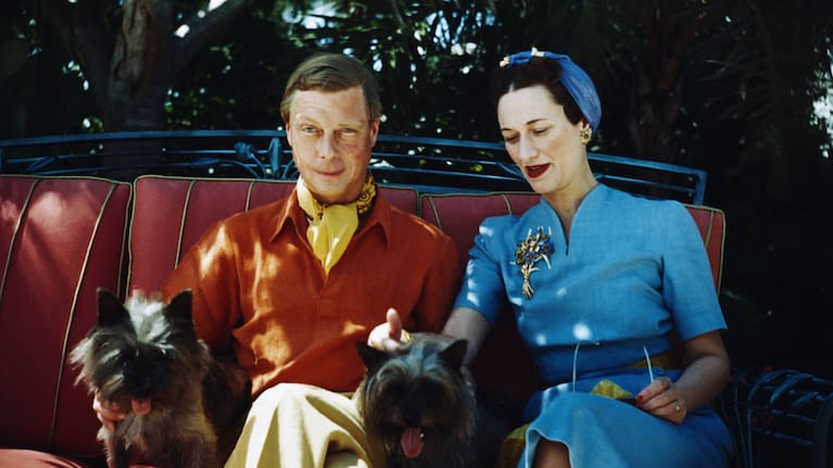 The Duke and Duchess of Windsor seated outdoors with their two small dogs