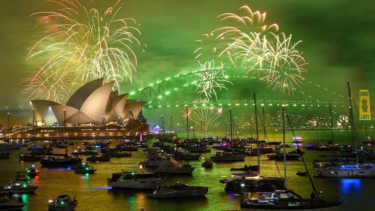 The "family fireworks", displayed three hours before midnight every year ahead of the main show at midnight, fill the sky over the Opera House and Sydney Harbour Bridge in Sydney.