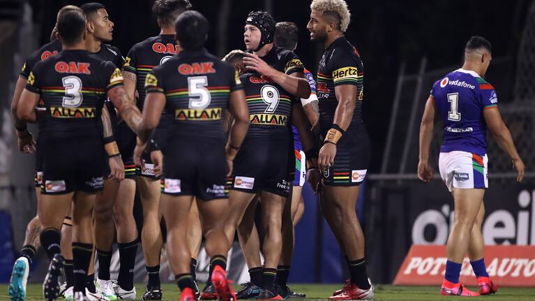 SYDNEY, AUSTRALIA - JUNE 05: Matt Burton of the Panthers celebrates with team mates after scoring a try during the round four NRL match between the Penrith Panthers and the New Zealand Warriors at Campbelltown Stadium on June 05, 2020 in Sydney, Australia. (Photo by Mark Kolbe/Getty Images)