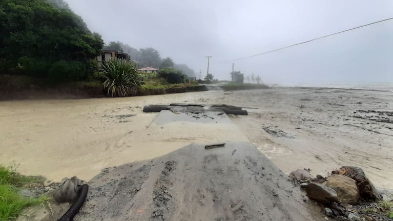 The road at Waipiro Bay is washed out during Cylone Fili.