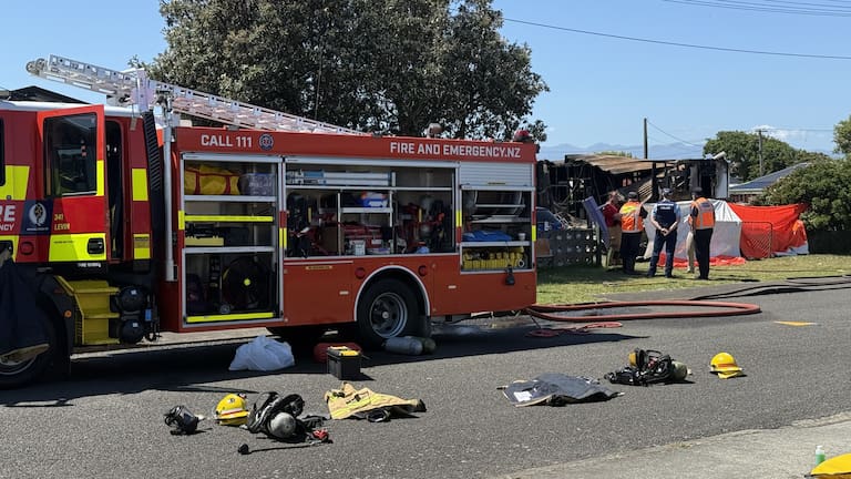 The scene of a fire on Queen Street, Foxton Beach where two people remain unaccounted for.