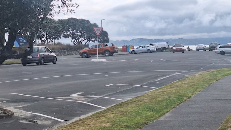 The wonky give-way sign (left) facing in the wrong direction, which a local resident says took 10 days to fix.