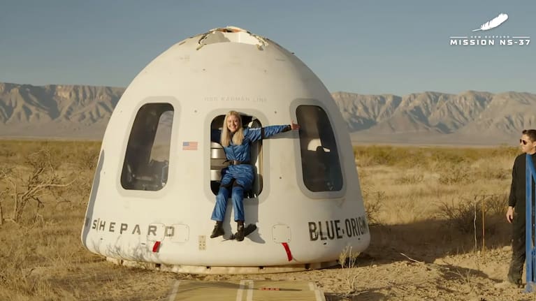 This image provided by Blue Origin, Michaela Benthaus poses after the Blue Origin's capsule landed