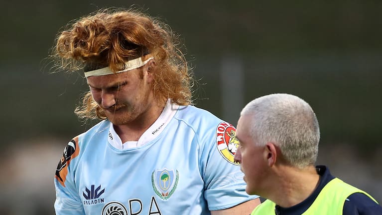 Tom Robinson leaves the field hurt during an NPC game in 2018.