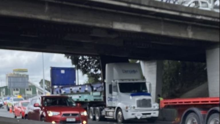 Truck stuck under Penrose bridge.