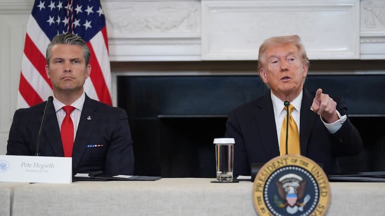 President Donald Trump answers questions from reporters during a roundtable on criminal cartels in the State Dining Room of the White House, Thursday, Oct. 23, 2025, in Washington, as Defence Secretary Pete Hegseth listen