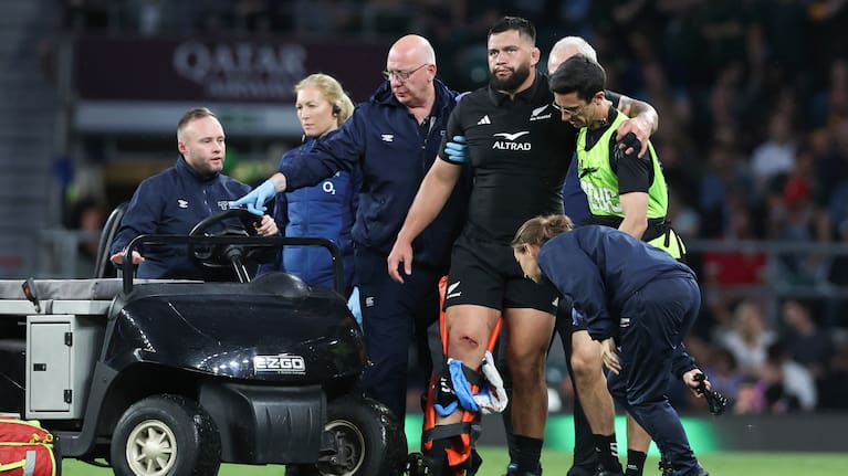 Prop Tyrel Lomax leaves the pitch with a gashed knee.