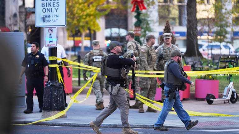 US Marshalls and National Guard troops are seen after reports of two National Guard soldiers shot near the White House in Washington.