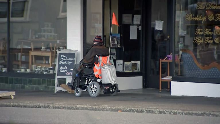 A local moves past shops in Featherston, Wairarapa.