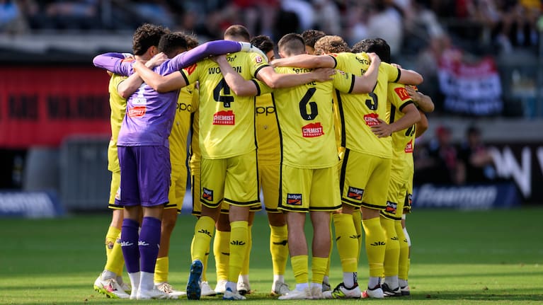 Wellington Phoenix in a huddle during their A-League Men's match against Western Sydney Wanderers.