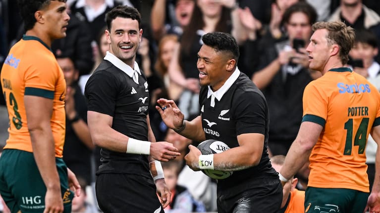 Wing Caleb Clarke, right, celebrates his try against the Wallabies with fullback Will Jordan.