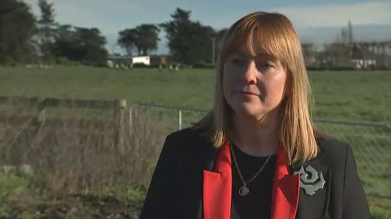 Detective Inspector Nicola Reeves, with a police search crew visible over her right shoulder.